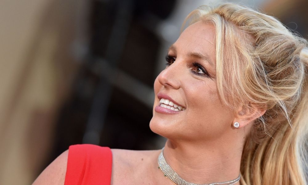 Popstar Britney Spears us in red top smiling court