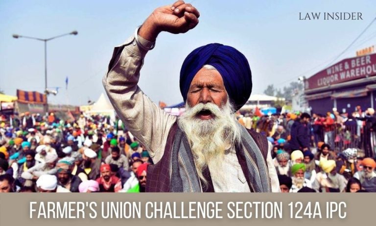 Farmers protesting, in daylight. A blue turban man leading the protest.
