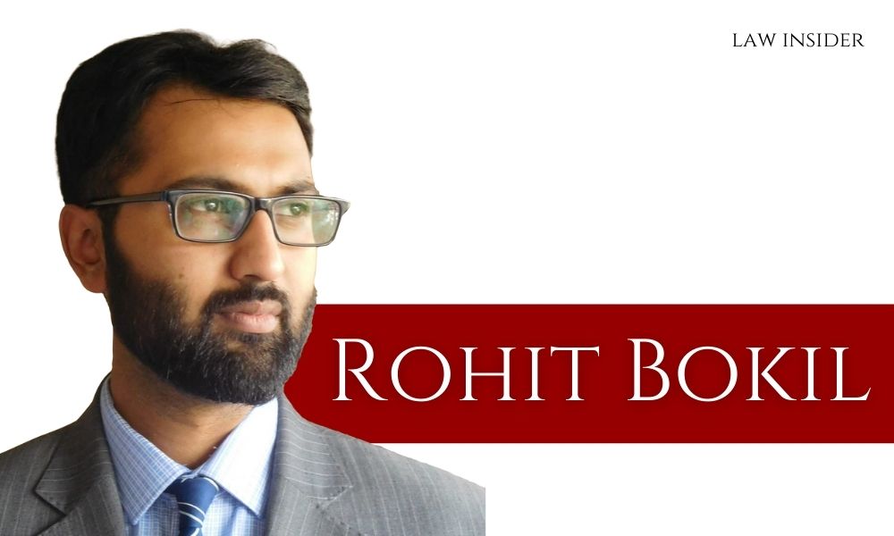 Rohit Bokil picture grey blazer specs