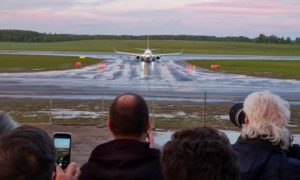 plane carring Roman Protasevich airport runway landing photographers click 